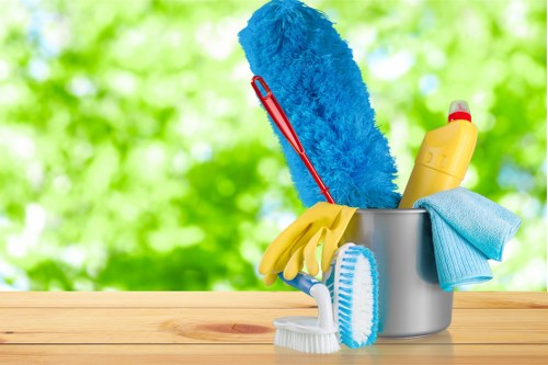Carpet cleaning technician preparing equipment with safety focus