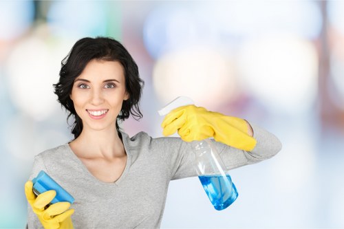 Cleaner working in a flat or family home in the E5 area of East London