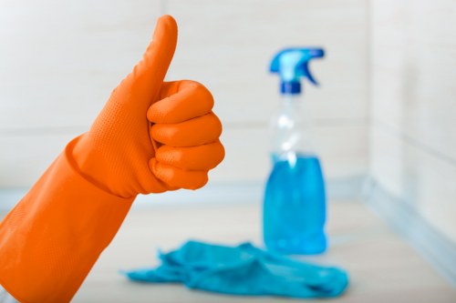 Local office cleaners maintaining a meeting room in E5