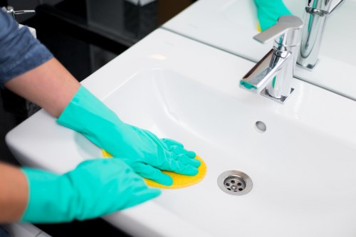 Local mattress cleaning technician working in an East London bedroom